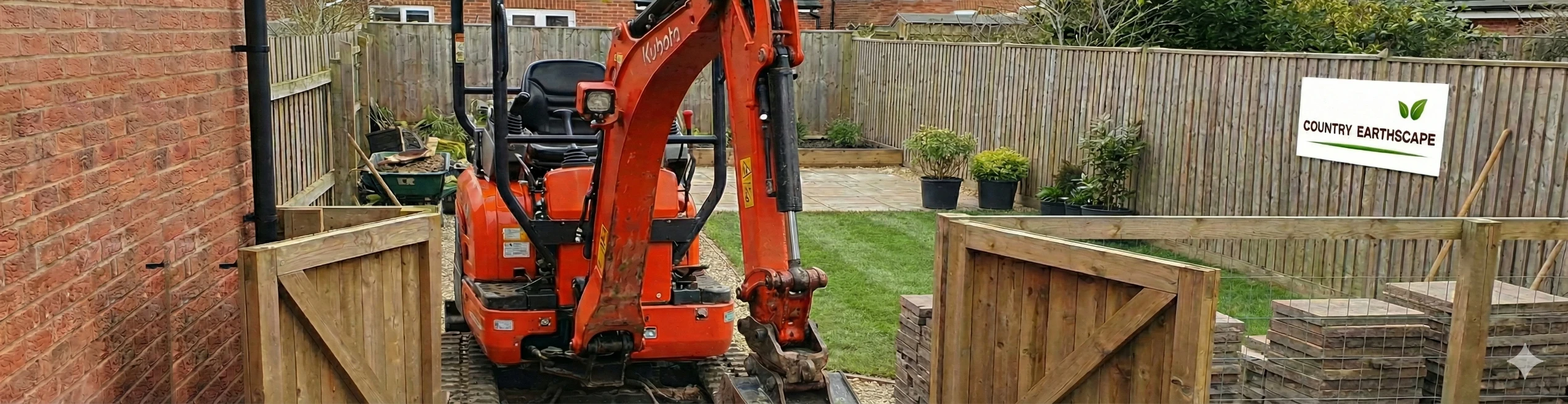 Mini excavator fitting through a tight residential side gate in Daylesford